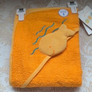 A New Infant Hooded Towel With A Fish That Squeeks When Squeezed.
